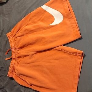 Small mens NIKE shorts. Coral color. Good condition